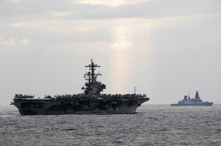 The Royal Navy, out there doing business, out of sight, out of mind? The new Type 45 destroyer HMS Dauntless escorts the Nimitz Class aircraft carrier USS George H.W. Bush during an exercise off the UK. Photo: Deven B.King/US Navy.